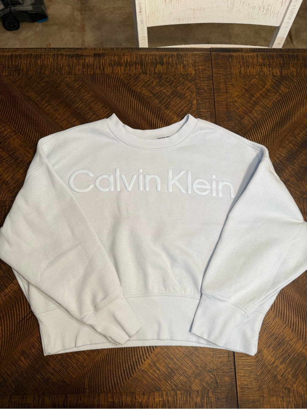 Calvin Klein Women’s light blue with white logo Crewneck Cropped Sweatshirt